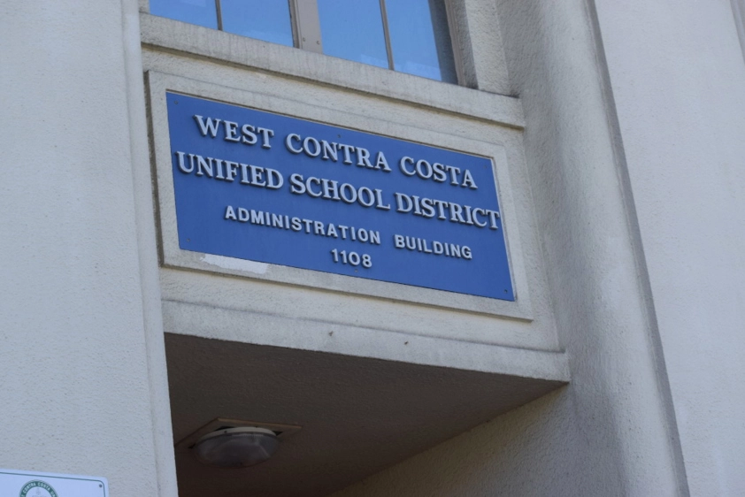 A sign reading 'West Contra Costa Unified School District.'